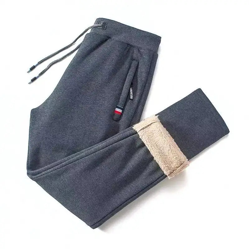 Gray sweatpants with beige lining on a white background