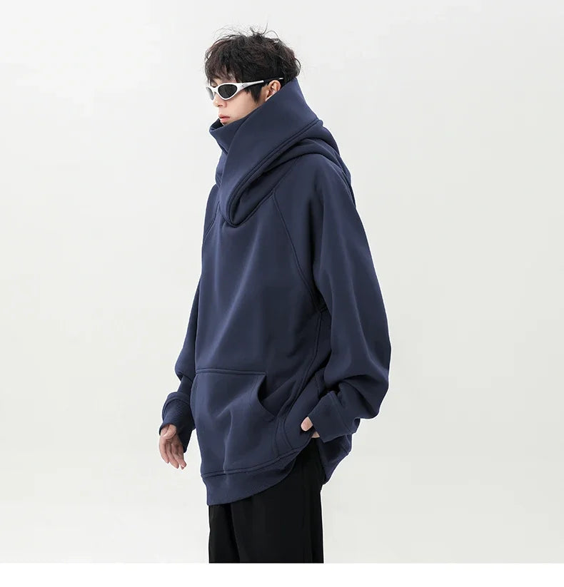 Person wearing a navy blue hoodie on a white background