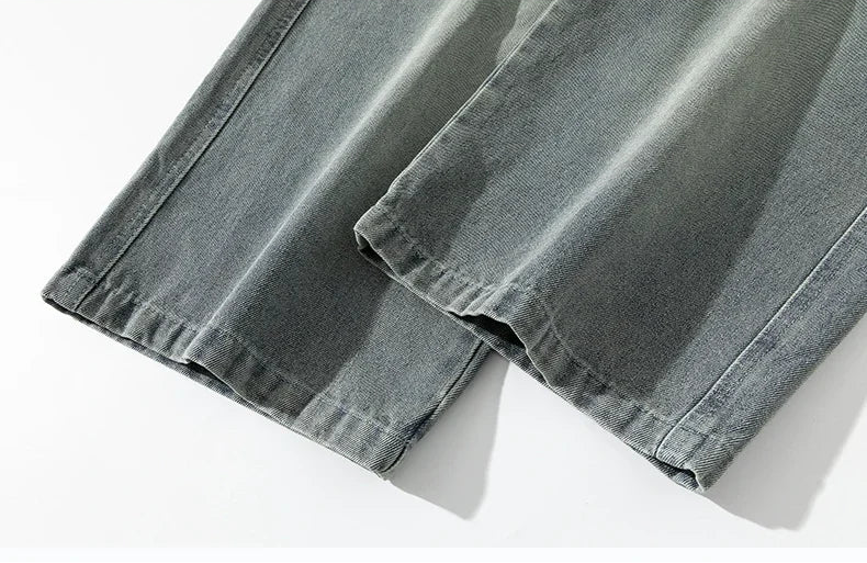 Close-up of gray denim fabric on a white background