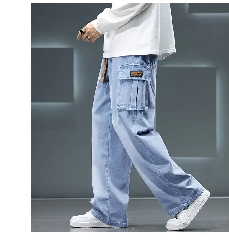 Light blue cargo pants worn by a person on a gray background