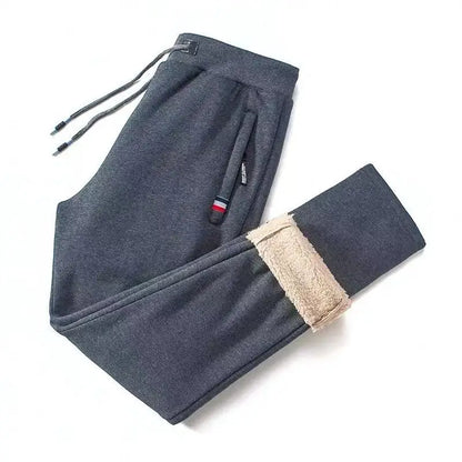 Gray sweatpants with beige lining on a white background