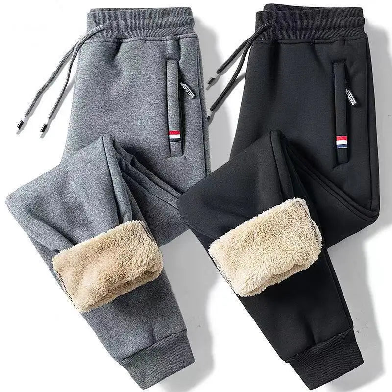 Gray and black sweatpants with fleece lining on a white background