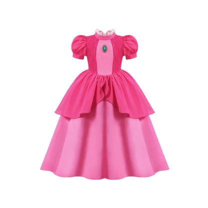 Pink dress with a green gem on a white background